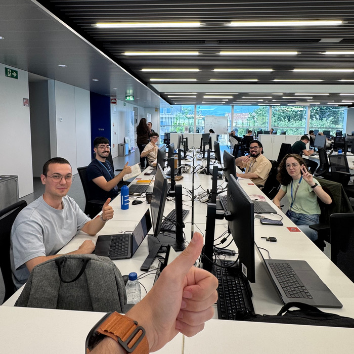 The Kode team at their desks in Lanzadera, all thumbs up to the camera