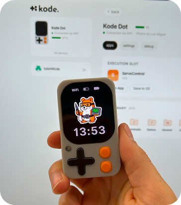 A hand holding a Kode Dot prototype running kodeOS, in front of the Kode ecosystem web app
